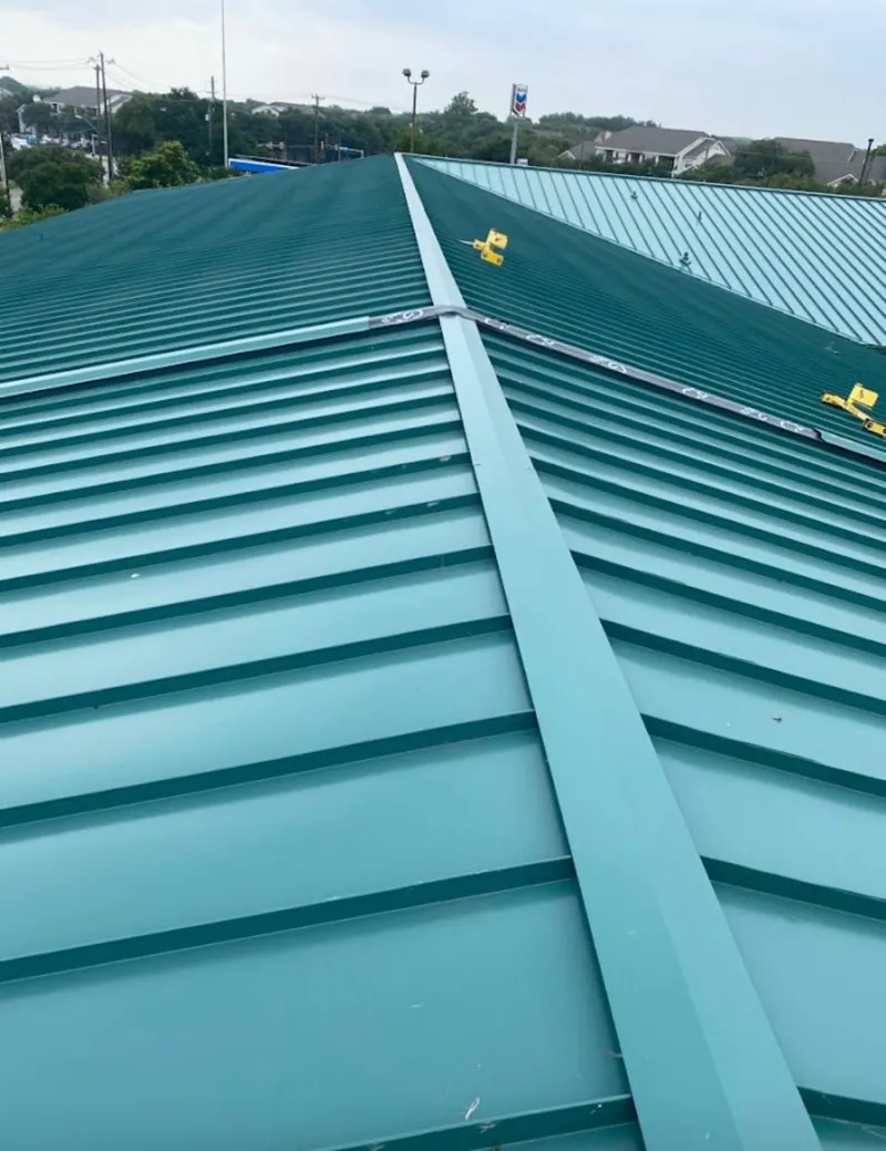 Green commercial metal roof ridge and valley for Metal Roof Repair in Wendell